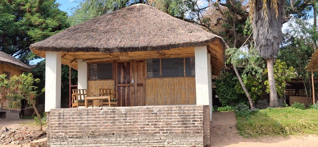 Thatched Lake View Room (Ngoni) chalet with its veranda at Anake Lodge, Cape Maclear – photo 10 of 14