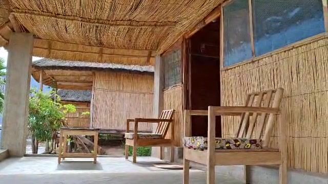 Standard Room: Shaded veranda with chairs outside the Tumbuka room, Anake Lodge, Cape Maclear – photo 12 of 12